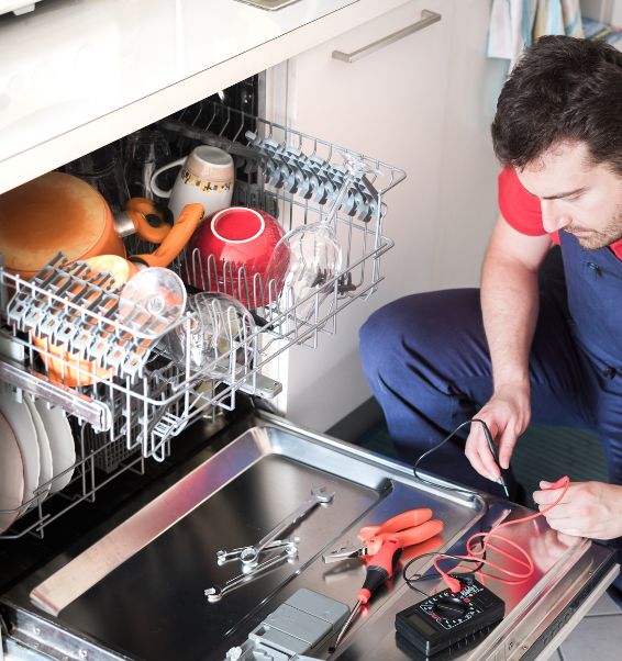 professional worker repairing dishwasher in the kitchen louisville ky